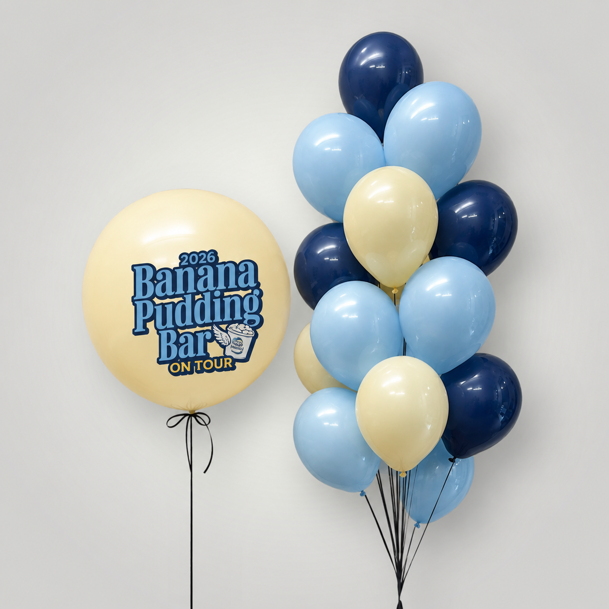 Custom Order (Banana Pudding Bar Tour) - 7 bundles (large custom balloon & bunch of 10 regular balloons) & 8x8ft Organic Balloon Arch; Colors - pastel yellow, baby blue, navy blue; Delivery to 6 locations